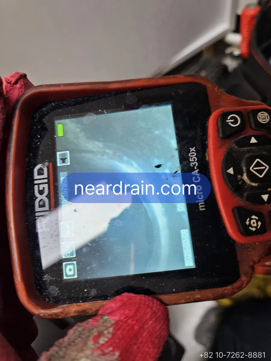 Villa kitchen drain line descaled with flex-shaft machine