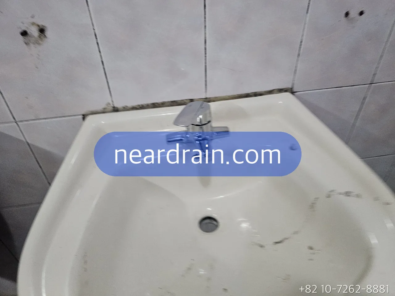 Basin mixer tap being serviced in a Seoul bathroom