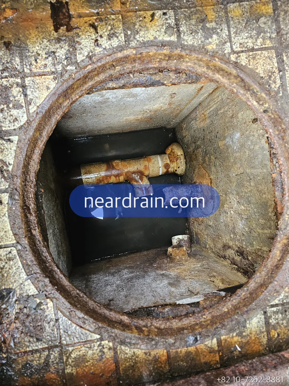 Inside a pit showing the discharge pipe, union and check valve